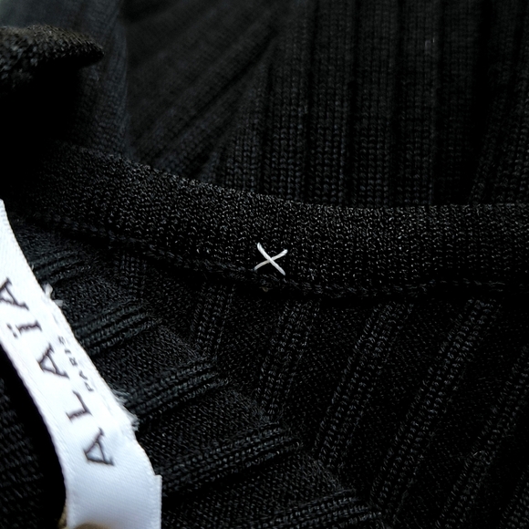 Alaia long sleeve wool blend ribbed knit bodysuit in black - Picture 9 of 12